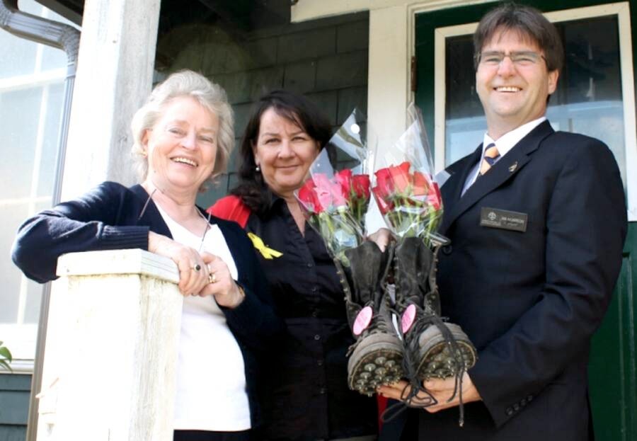“Pat Foster with the Kaatza Station Museum, CVRD Director Area D Lori Iannidinardo, and Ian Morrison, CVRD director Area F, appreciate a pair of workboots with roses placed inside that Iannidinardo brought to the Day of Mourning ceremony’s tea at Lake Cowichan’s Kaatza Station Museum and Archives in memory of fallen workers.” (Lake Cowichan Gazette/April 30, 2014) 