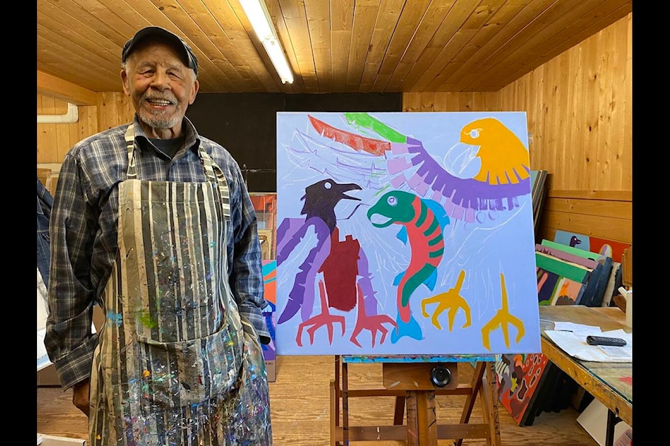 Lake Cowichan artist Robert Burke will have five of his painting on display at the University of Victoria downtown Legacy Art Gallery for his Masked Identity exhibit that will run until Sept. 7. Burke stands next to one of his paintings inside his studio on Somenos Road, that is not a part of his Masked Identity exhibit. (Chadd Cawson/Gazette) 