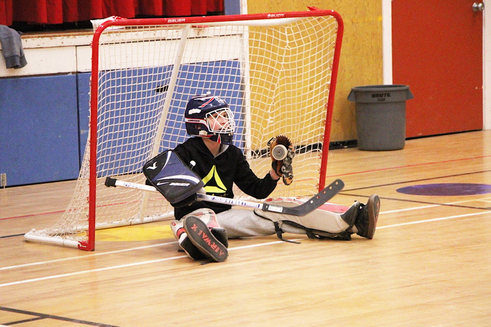 Xavier Taylor defends his net during a game of floor hockey at 100 Mile Elementary School. (Patrick Davies photo - 100 Mile Free Press) 
