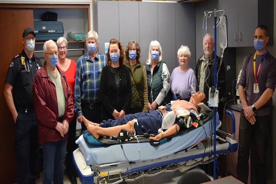 Representatives from the Arrow Lakes Hospital Foundation and NACFOR watch a demonstration of the newly purchased equipment, “Megacode Kelly.” (Arrow Lakes Hospital Foundation) 