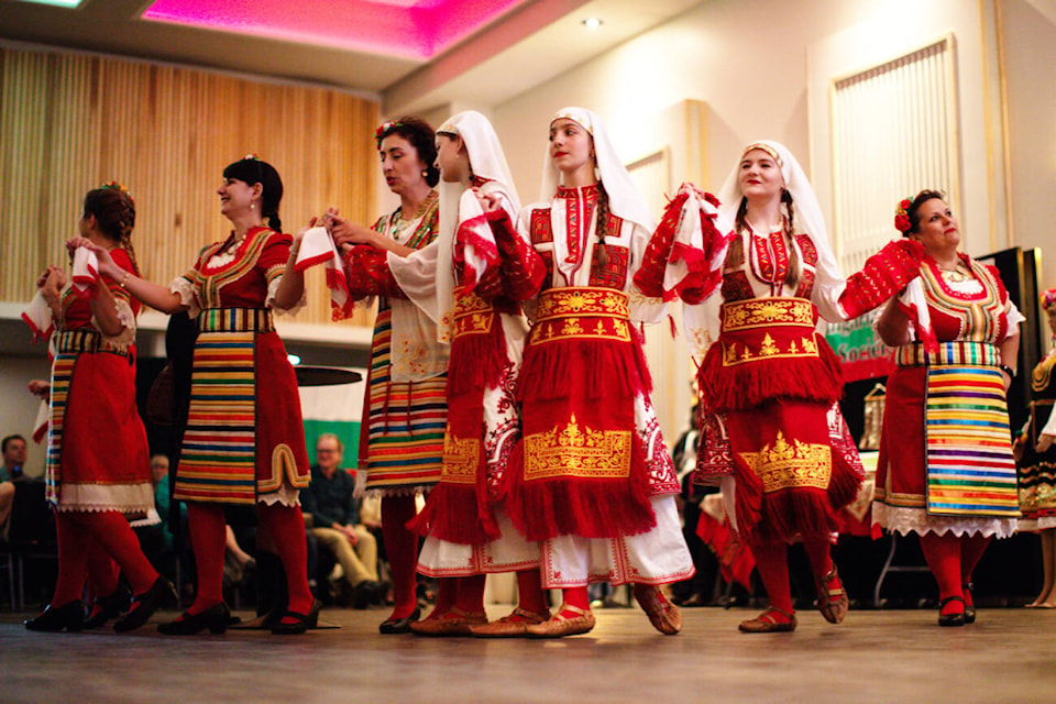 Audience members are treated to traditional dance and music during the Days of Bulgaria Festival held at Song Sparrow Hall on Friday, April 19, 2024. (Kayleigh Seibel Photography) 