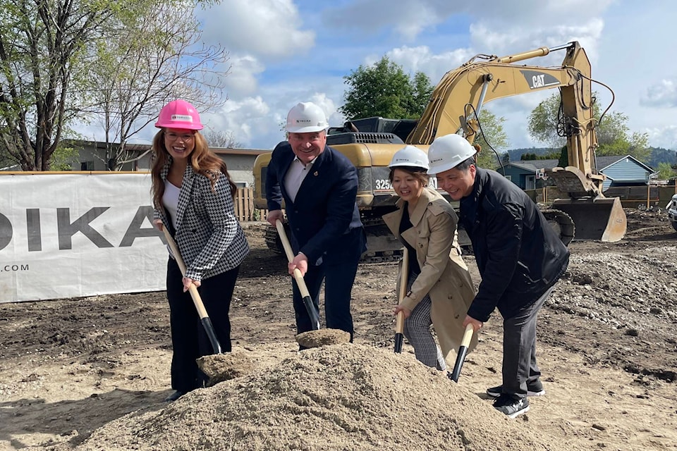 Troika Developments Co-CEO Renee Merrifield (left) and Kelowna Mayor Tom Dyas (second from left) take part in a ground-breaking ceremony for a rental-only project being built at 1110 Lawson Ave. (Gary Barnes/Captial News) 
