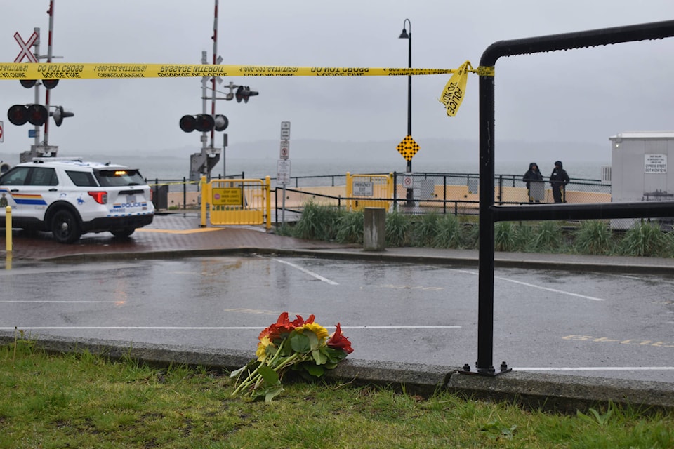 Flowers were laid out near the scene of a fatal stabbing in White Rock Wednesday morning (April 24), after a man died Tuesday night on the city’s waterfront. It was the second stabbing in 2 days in the city. (Tricia Weel photo) 