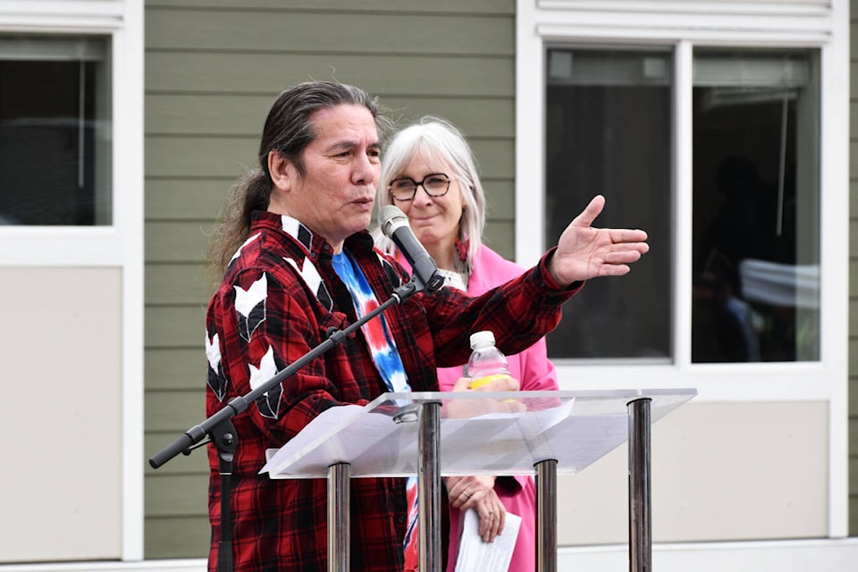 Kukpi7 (Chief) James Tomma, with Minister of Indigenous Services Patty Hadju, addresses the crowd at the Welcome Home celebration of the new Dancing Fawn II neighbourhood on Wednesday, April 24. (Heather Black-Salmon Arm Observer) 