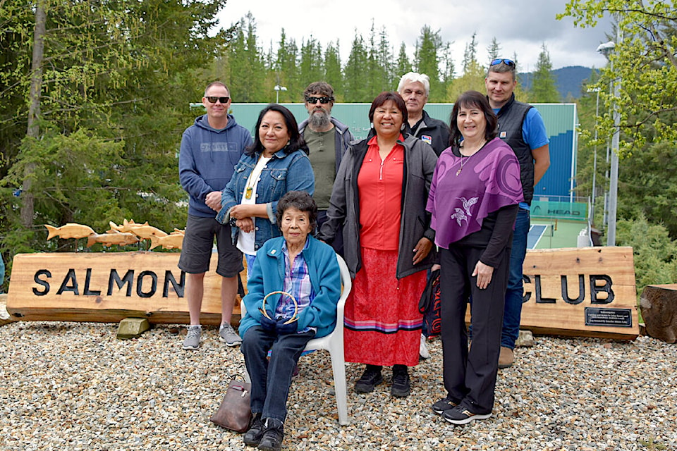 The different groups that collaborated on creating the Salmon Arm Tennis Club’s new sign gathered for its unveiling and indigenous blessing on Saturday, April 27. In the back row, from left, is Geoff Porter and Robin Wiens from the Storefront School, Métis carver John Sayers, and Interfor manager Erik Kok. In the middle is Adams Lake Band Coun. Joyce Kenoras, Neskonlith Coun. Frances Narcisse, club VP Marianne VanBuskirk and Adams Lake Elder Lily Anthony. (Heather Black-Salmon Arm Observer) 