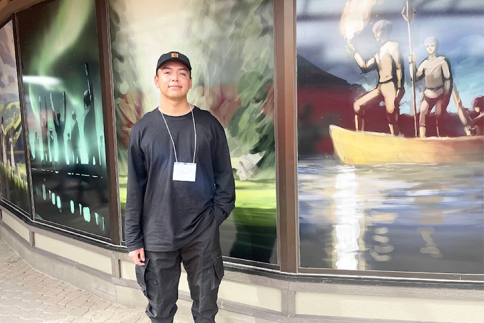 Artist Autumn Christopher stands in front of the artwork he brought to life at the Deni House extended care unit, at Cariboo Memorial Hospital in Williams Lake. (Ruth Lloyd photo - Efteen) 