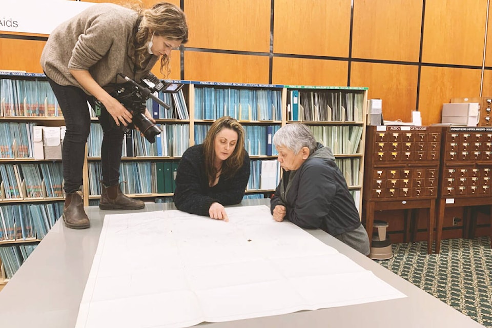 Filmmaker Emily Kassie films Whitney Spearing, centre, and Charlene Belleau during the making of the film Sugarcane. (Julian Brave NoiseCat photo) 