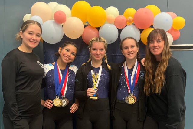Cariboo Chilcotin Gymnastics coaches and gymnasts pose with their medals and trophies from the Carol Lenz Memorial Invitational. (Annie Glanville/Contributed to Black Press Media) 