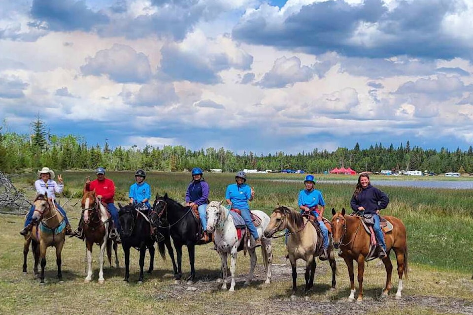 Jaxson Sam, left, Ted Sam, Zaley Dick, Montana Hance, Precious Stump, Marcia Hance and Paula Splichal at the annual Tl’etinqox community gathering at Anah Lake - open to all. (Garrett Wilson photo) 