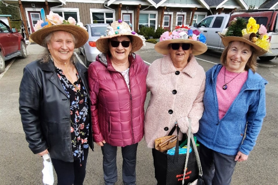 Beta Sigma Phi members visiting Evergreen Acres Seniors residential area in Clearwater to deliver Easter treats in 2024. Seen here (from left to right): Niki McMillan, Luci Doull, Marnie Burnell and Joan Slingsby delivering Easter bags with treats inside. (Photo submitted: Beta Sigma Phi) 