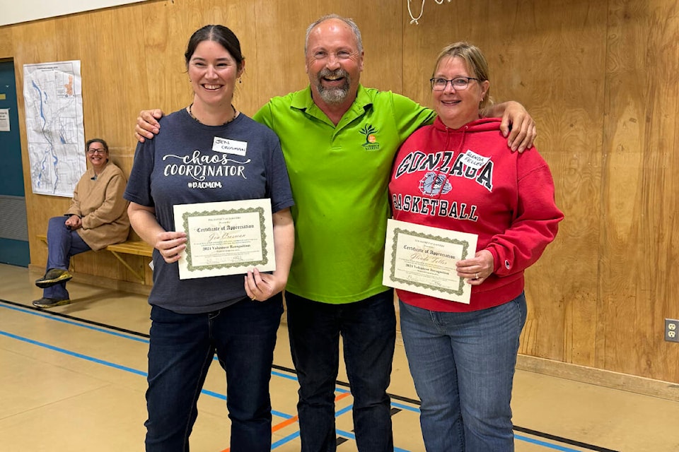 Jen Crosman (from left), Mayor Ward Stamer and Glenda Feller are all smiles as the mayor congratulated the two volunteers during the April 25 volunteer recognition event at The Ridge in Barriere. (Jamie Mosdell photo) 