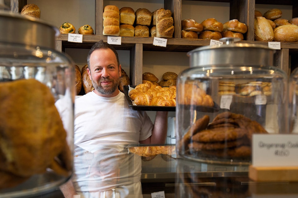 Tom Moore, co-owner of Crust Bakery, shows off some fresh croissonts. (simplymastery file photo) 