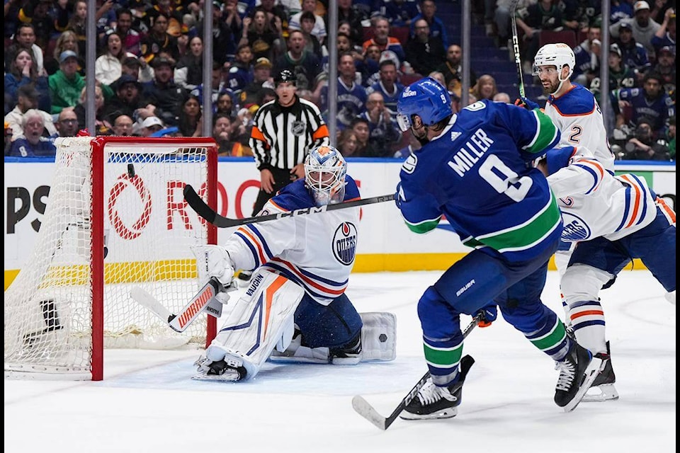 Vancouver Canucks’ J.T. Miller (9) scores the winning goal against Edmonton Oilers goalie Calvin Pickard during the third period in Game 5 of an NHL hockey Stanley Cup second-round playoff series, in Vancouver, on Thursday, May 16, 2024. THE CANADIAN PRESS/Darryl Dyck 