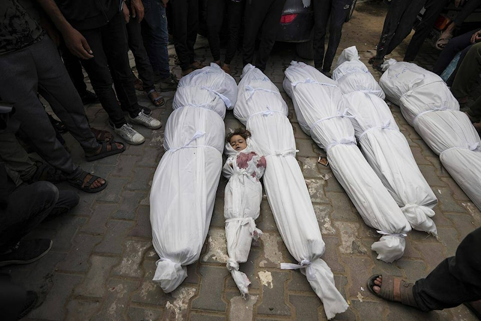 Palestinians mourn their relatives who were killed in an Israeli airstrike in Nuseirat, at the Al Aqsa hospital in Deir al Balah, Gaza Strip, Sunday, May 19, 2024. (AP Photo/Abdel Kareem Hana) 