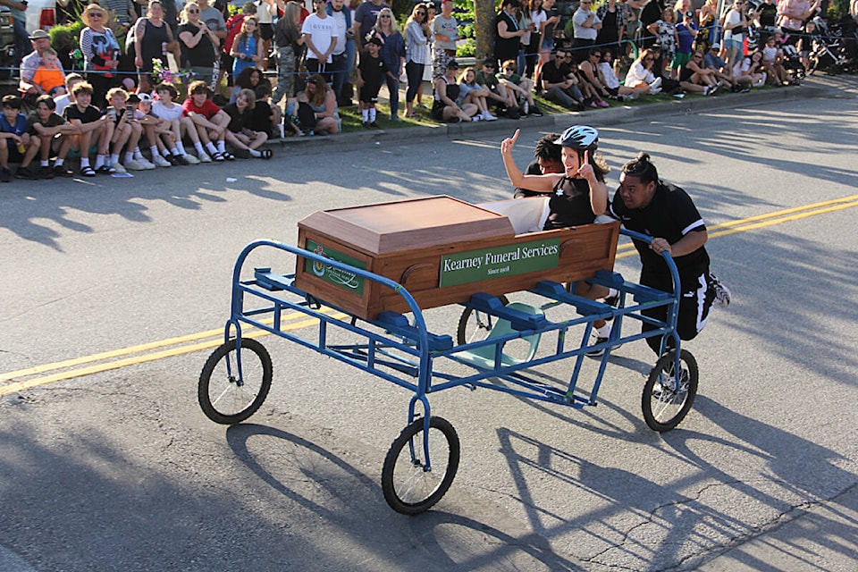 Nina Garisto rides in the custom-built Coffin Car from Kearney Funeral Services during the 2023 Cloverdale Bed Races. (Photo: Malin Jordan) 