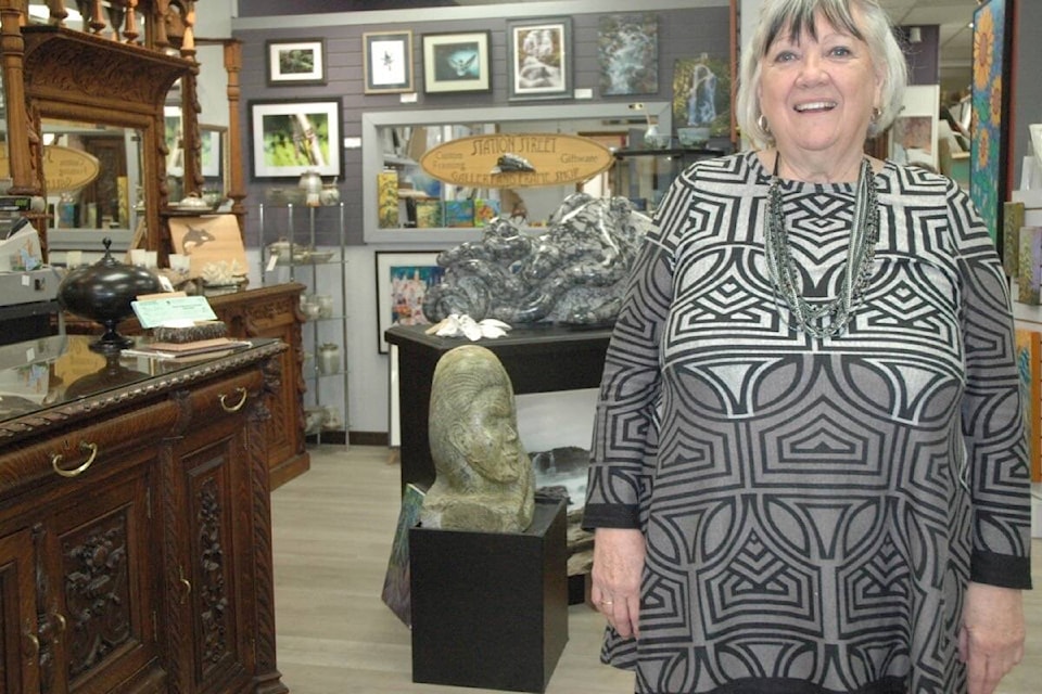 Station Street Gallery owner Linda Roseneck, gifted an antique shield to the International Medieval Combat Federation to mark their 10th anniversary. The shield will be awarded to the country that wins the most gold medals at the world championships that will be held in Mexico from May 2 to 5. (Robert Barron/Citizen) 