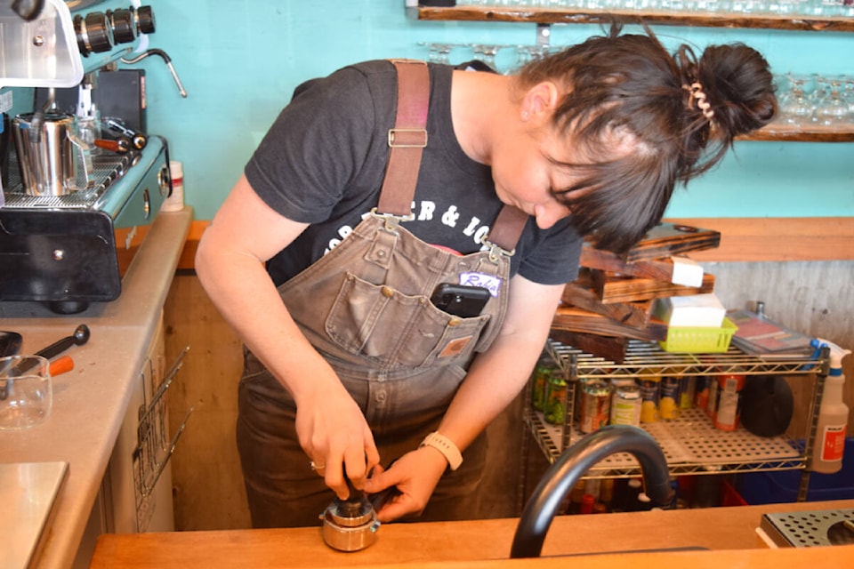 Robin Richards tamps a shot of espresso at Alberni Premium Coffee. (ELENA RARDON / Alberni Valley News) 