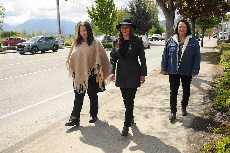 From left: Debra Sparrow, Denise Douglas and Luwana Williams commemorated the 1969 Moccasin Miles event 55 years later, on April 30, along Yale Road in Chilliwack. (Jenna Hauck/ Chilliwack Progress) 