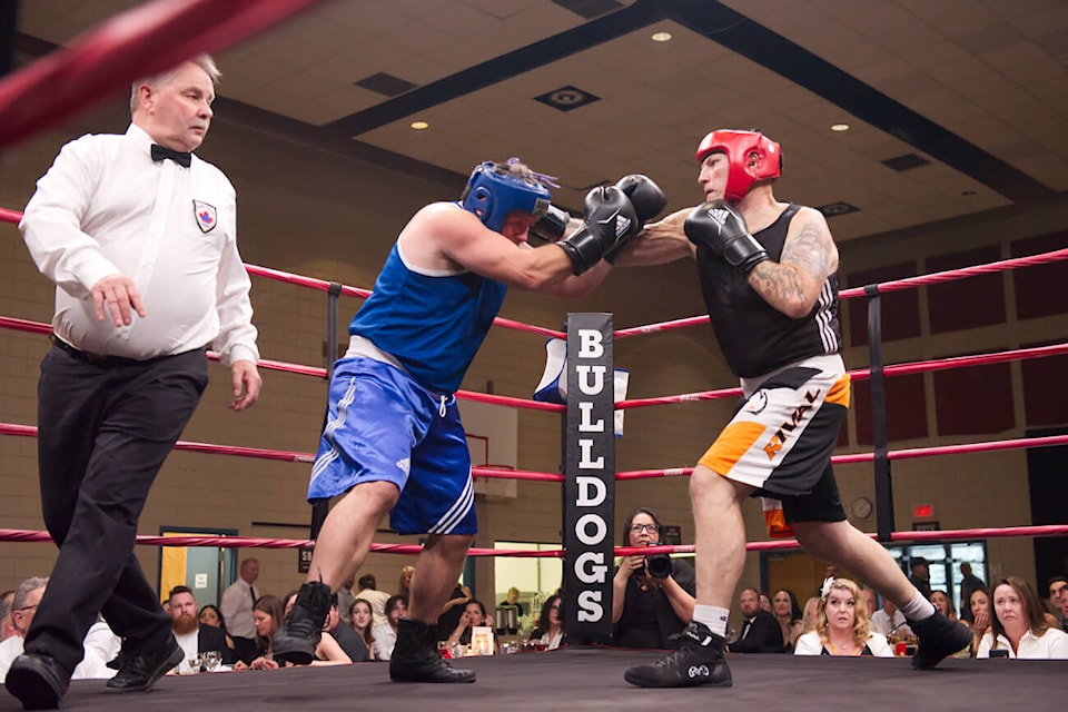 Cranbrook Eagles Boxing’s Andy Britner is unable to block a blow from Bulldogs Boxing’s Shawn Hay in the first bout of the Hit2Fit Gala at the SASCU Recreation Centre last Saturday night, April 27. Hay would go on to win the Masters/Male bout. (Lachlan Labere/Salmon Arm Observer) 