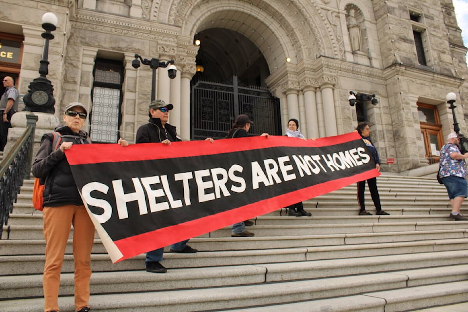 Members of the Housing Justice Project released their report on homelessness in Victoria at the B.C. legislature on May 7. (Jake Romphf/News Staff) 