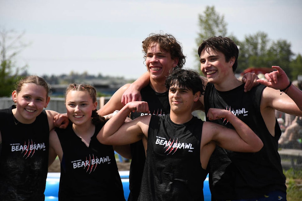 A group celebrates after doing the team challenge at St. John Brebeuf’s Bear Brawl on May 3. (Ryleigh Mulvihill/Abbotsford News) 