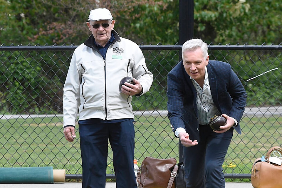 Ed Bach (left) and Mayor Ross Siemens (right) lawn bowling. (John Morrow/Abbotsford News) 