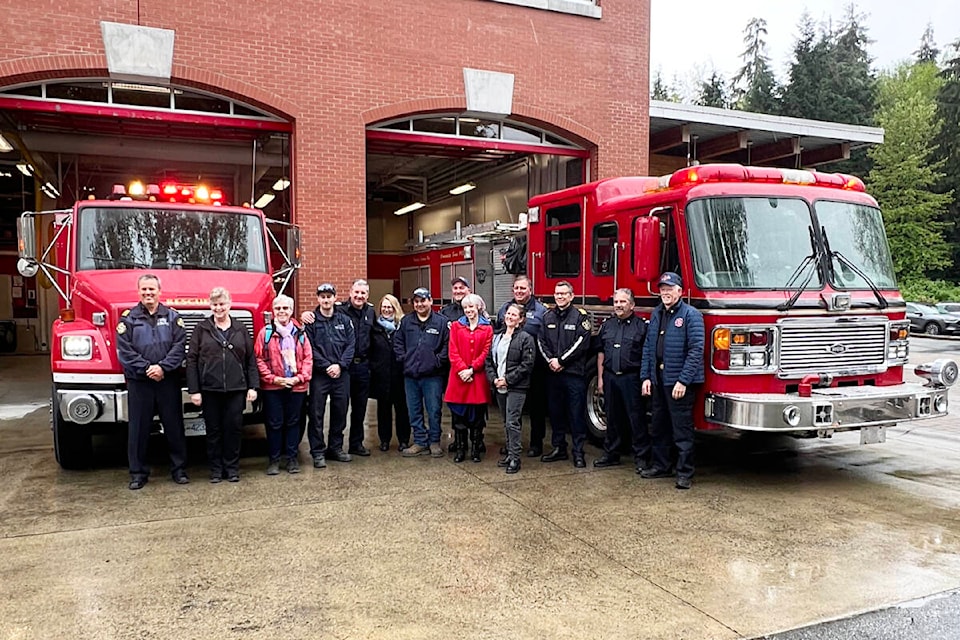 Representatives from the City of Port Moody, the Village of Lytton, and the Loon Lake Volunteer Fire Department with the surplus rescue truck (l) and fire engine being donated to Lytton and Loon Lake respectively by the City of Port Moody. (Photo credit: Submitted) 