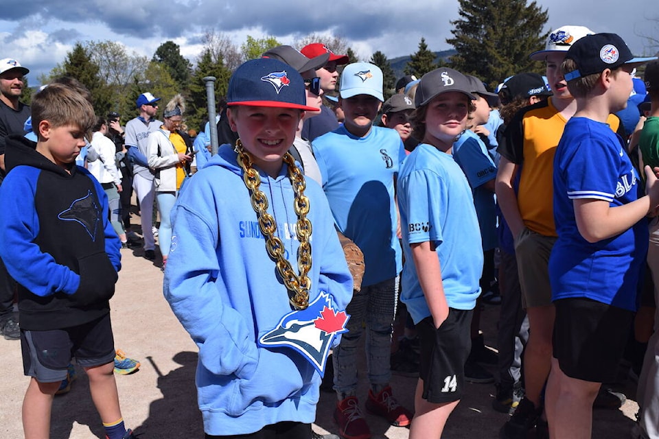 Jayden McIntyre sporting a gold Blue Jays chain during a funding announcement to improve Kelowna’s Edith Gay Park diamond. (Brittany Webster/Capital News) 