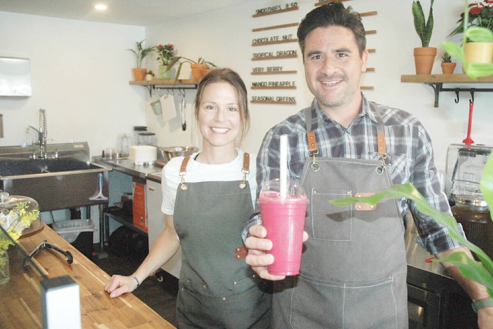 Keir and Brittany McPherson are the owners of Lake Cowichan’s new Garden Made store. Kier is holding a Tropical Dragon smoothie, one of the store’s top sellers. (Robert Barron/Citizen) 