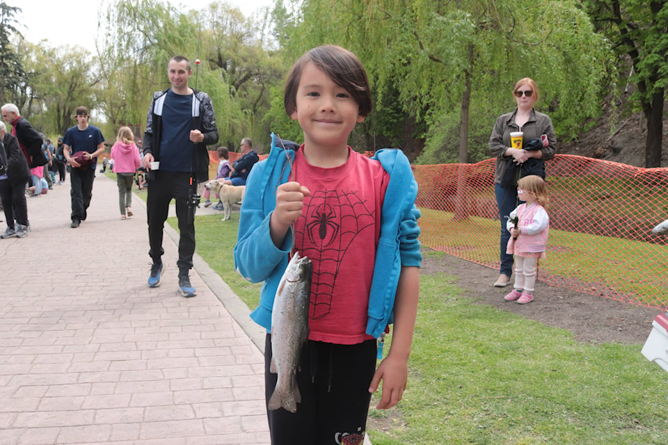 Six-year-old Kaisei March shows off his catches at the Kalamalka Fly Fishing Society’s annual kids’ fish-out event Saturday, May 4, 2024. (Brendan Shykora - Morning Star) 