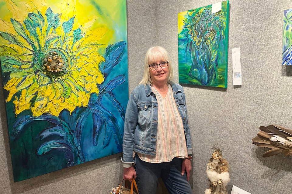 Marilyn Bifano stands amongst some of her creative creations on display with her Station House Gallery show in the main gallery from May 3 until May 25. (Ruth Lloyd photo - Williams Lake Tribune) 