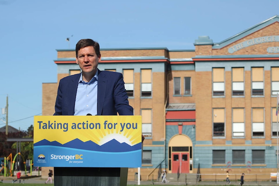 Premier David Eby speaks at a May 14 announcement in Victoria about integrating child care in existing school sites. (Jake Romphf/News Staff) 