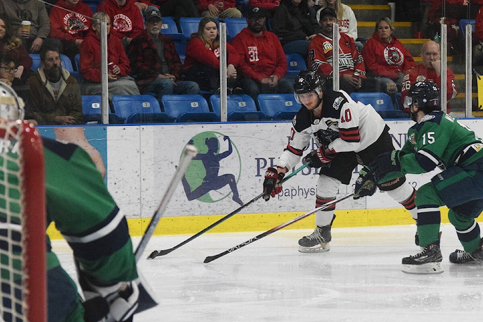 Hayden Stavroff of the Alberni Valley Bulldogs drives to the Surrey Eagles net, guarded by Eagles defender Josh Wessels, during Game 3 of the Coastal Conference Finals. (ELENA RARDON / Alberni Valley News) 