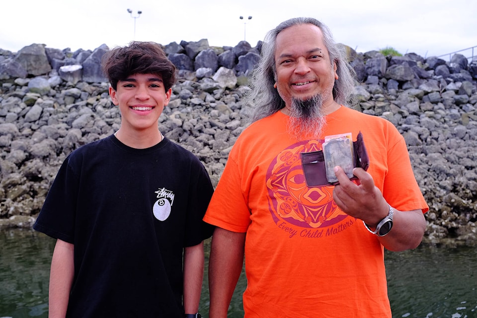 Nick Chowdhury (right) was in his early twenties when he lost his wallet while fishing in 1991. More than 30 years later, on May 10, 2024, Jamie Lee, aged 14, would return his wallet, finding it at roughly the same location where Chowdhury last saw it. (Olivier Laurin / Comox Valley Record) 