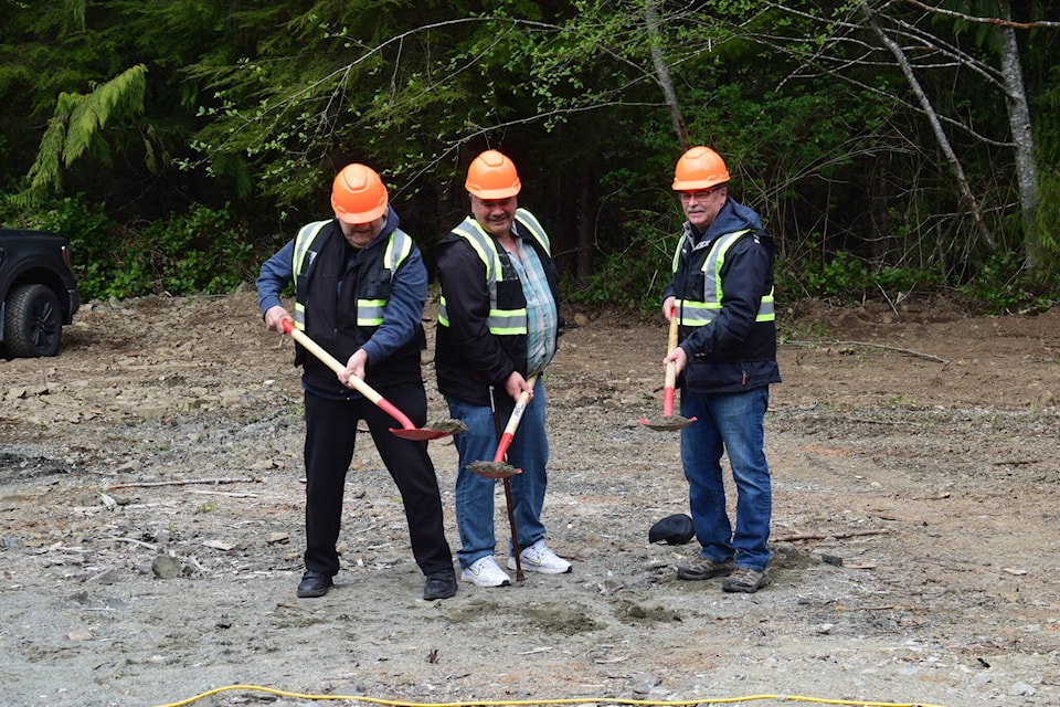 Quatsino First Nation chief Tom Nelson, Quatsino Economic Development LP board vice-chair Charles Sheard, and MLA Michele Babchuk’s constituency assistant Fred Robertson break ground at the site where the Quatsino First Nation’s new gas station will be built off the Coal Harbour road. (Tyson Whitney - North Island Gazette) 