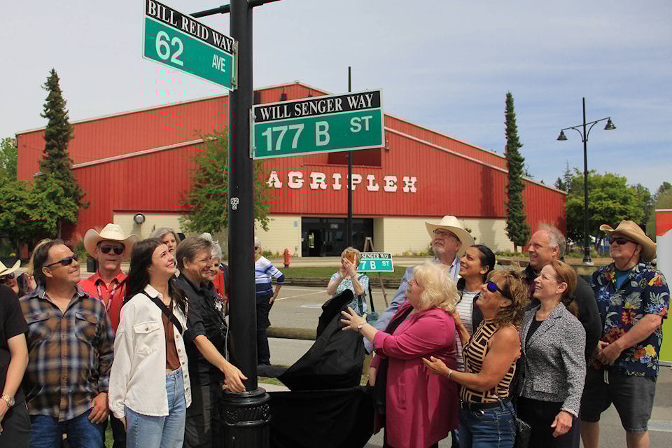 Mayor Brenda Locke unveils the honorary street sign “Will Senger Way” at the corner of 62nd Avenue and 177B Street on May 14. The sign honours Will Senger’s contribution to both Cloverdale and the Cloverdale Rodeo over the years. Lori Biersack, Senger’s daughter, is seen to the right of the mayor. (Photo: Malin Jordan) 