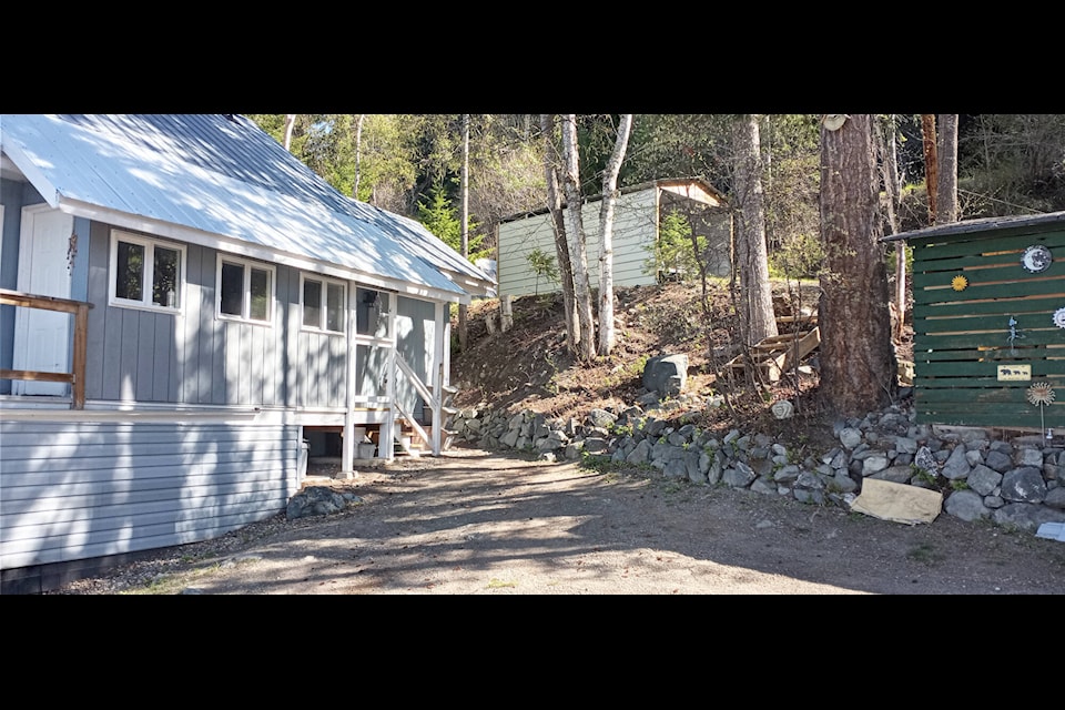 A house with metal roof and gravel surround, which Andy Hird said is good, but vinyl siding which is not for a FireSmart property. (Photo submitted) 