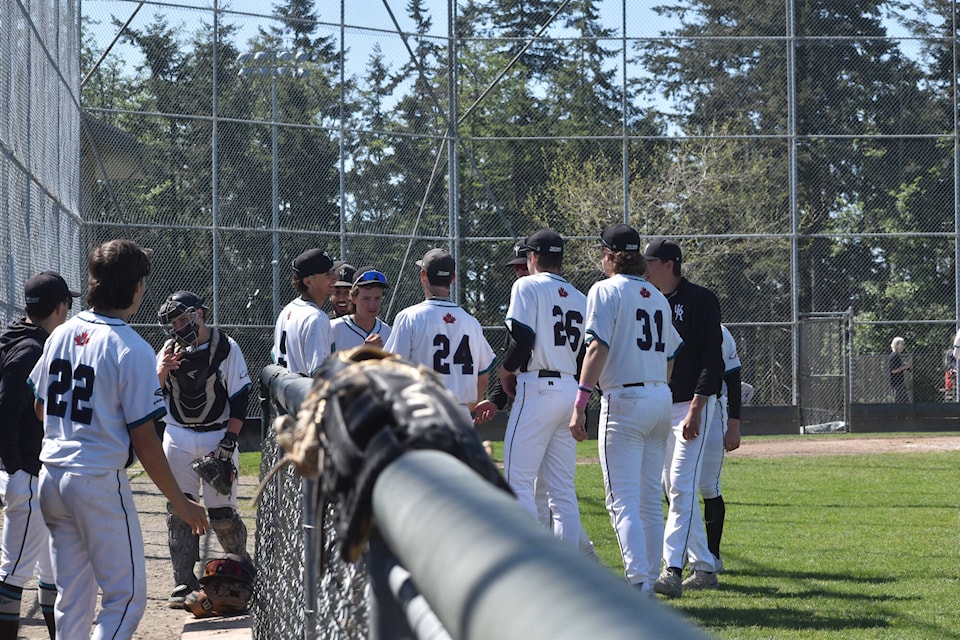 The White Rock Senior U18 Tritons in between innings during a Mother’s Day double header at South Surrey Athletic Park on Sunday (May 12). (Tricia Weel photo) 