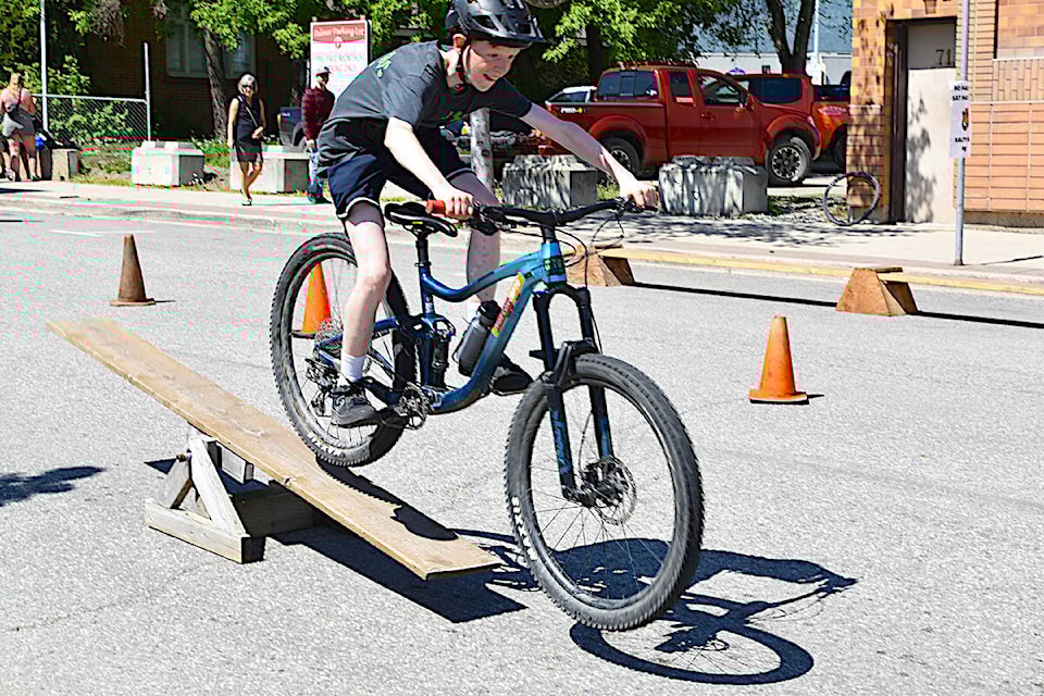 Aidan Jamieson catches air while going over the teeter totter during the Bike Games obstacle course at the Salty Dog Street Fest in downtown Salmon Arm on Saturday, May 11. (Heather Black-Salmon Arm Observer) 