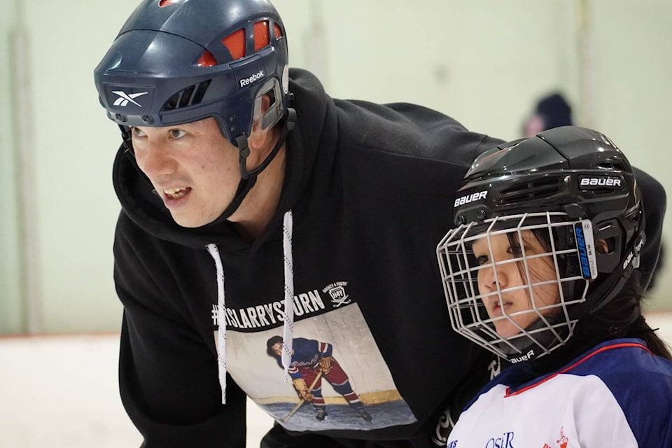 Chad Soon with Hockey 4 Youth player Samantha Diaz. Proceeds from the sale of The Longest Shot will support the Hockey 4 Youth program. (Dan Harbridge photo) 
