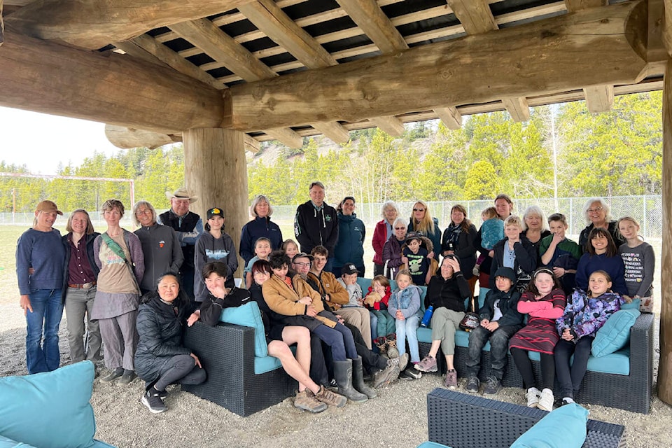 Students, staff and community members celebrate the new log shelter for the Tatla Lake School playground. (Photo submitted) 