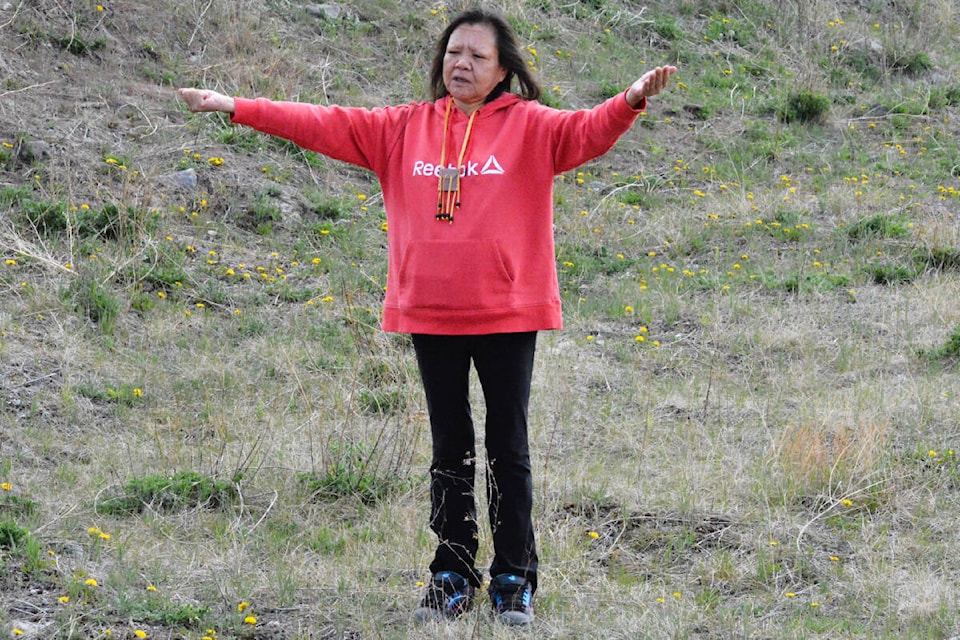 Roseanne Haller says a prayer to bless the ground at Tl’esqox First Nation where a new four-plex will be built. (Monica Lamb-Yorski photo - Williams Lake Tribune) 