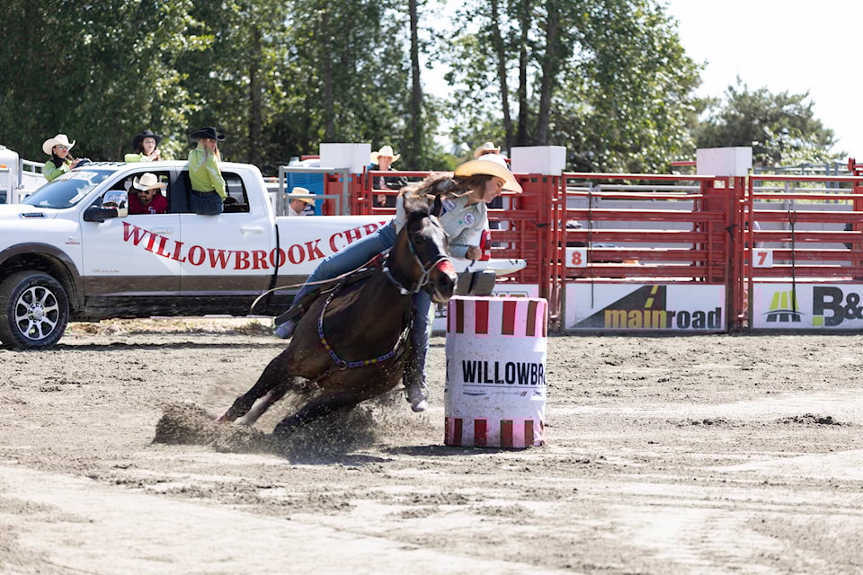 A ladies barrel racing competitor makes a turn during a performance at the 76th annual Cloverdale Rodeo. (Photo: Jason Sveinson) 