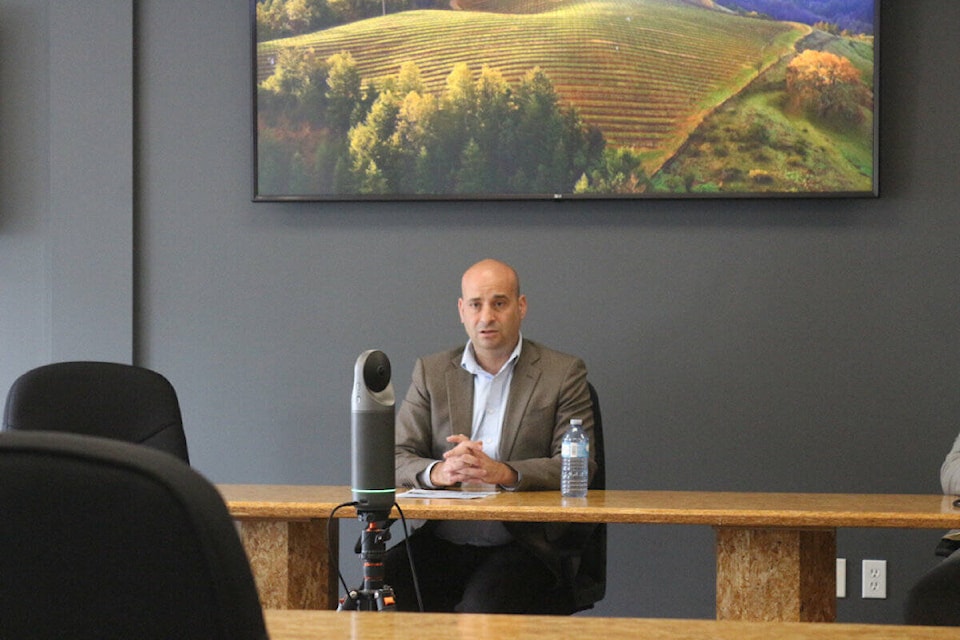 Frank Caputo, MP for Kamloops-Thompson-Cariboo, talks about his initiative to bring doctors to his riding at the District Council chambers of 100 Mile House (Misha Mustaqeem photo - simplymastery) 