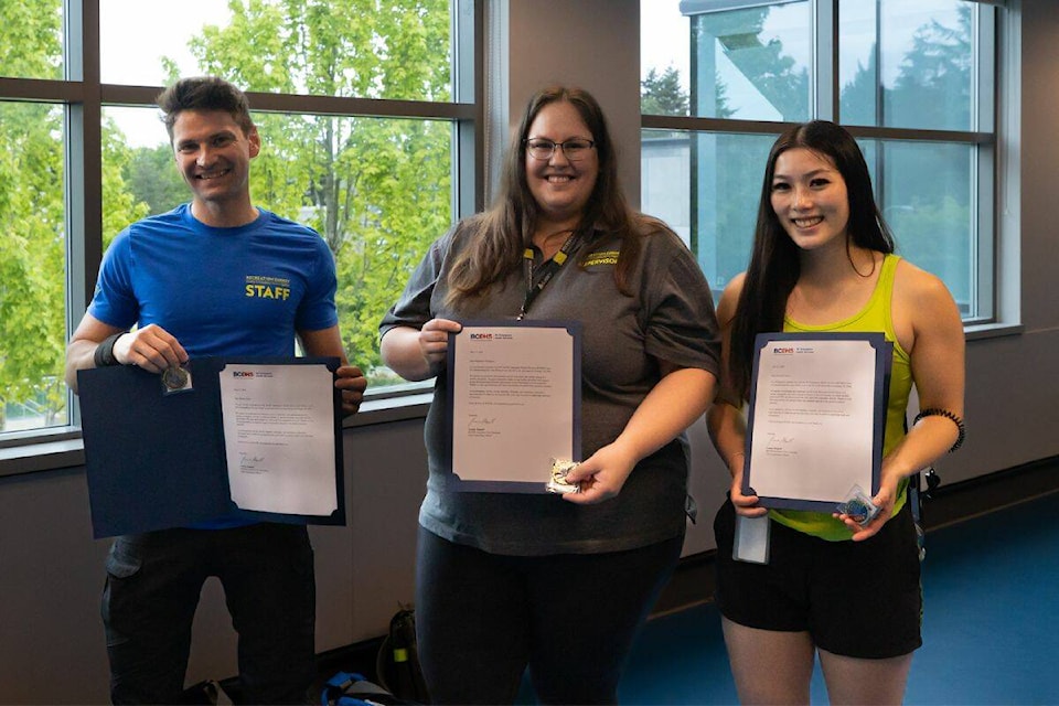 Romas Shmit left, Stephanie Thompson and Elisabeth Chow pose for a photo with their letters of commendation during the staff appreciation breakfast at Guildford Recreation Centre in Surrey on Thursday, May 16, 2024. (Photo: Anna Burns) 
