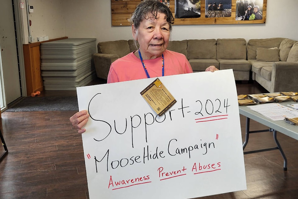 Splatsin traditional wellness Elder Jean Brown helped lead a poster-making and march Friday, May 17, to support the annual Indigenous-led Moose Hide Campaign, designed to try and stop violence against women and children. (Roger Knox - Morning Star) 