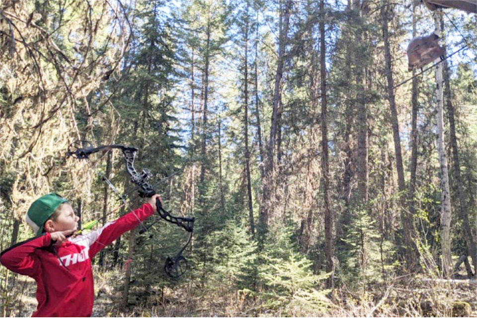 Joey Szekely takes aim at a flying racoon at the Cariboo Archers’ 2024 3D Funshoot on May 11. (Cara Fraser photo) 