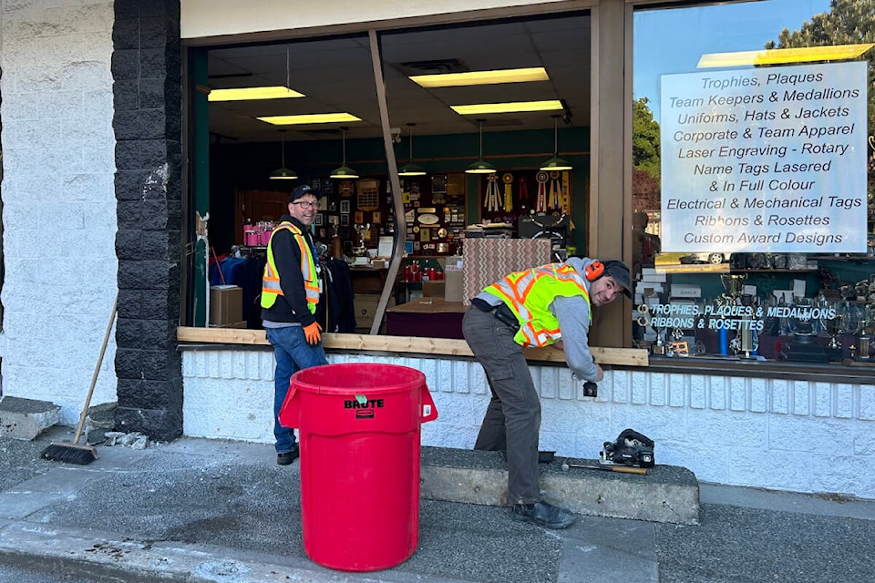 The aftermath of a car driving into a storefront on Blanshard Street. (Mark Page/News Staff) 