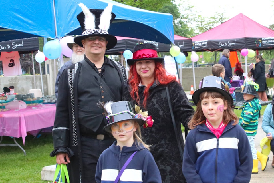 Dozens of community members attended the Mad Hatters Party in Memorial Peace Park on May 25. (Brandon Tucker/The News) 