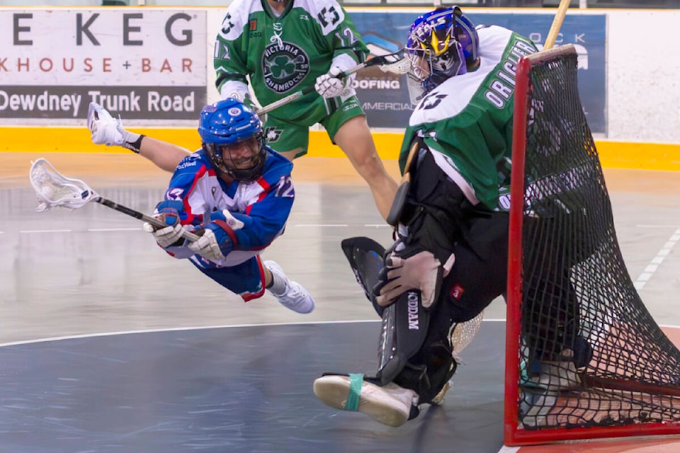 Garret Winter takes a diving shot on Shamrocks goaltender Chris Origlieri. (Paul Evans Photography/Special to The News) 